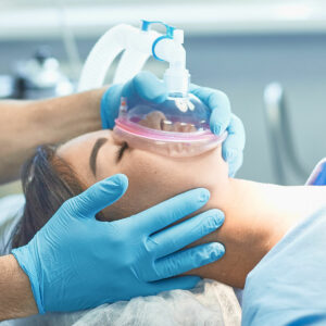 woman with anesthesia mask on