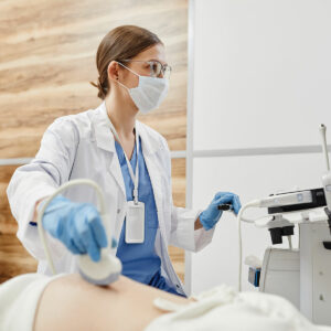 female doctor performing ultrasound