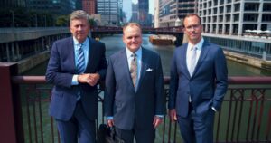 3 male lawyers standing in front of river in chicago